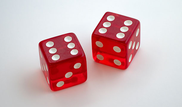 A pair of red dice, both landed on six.