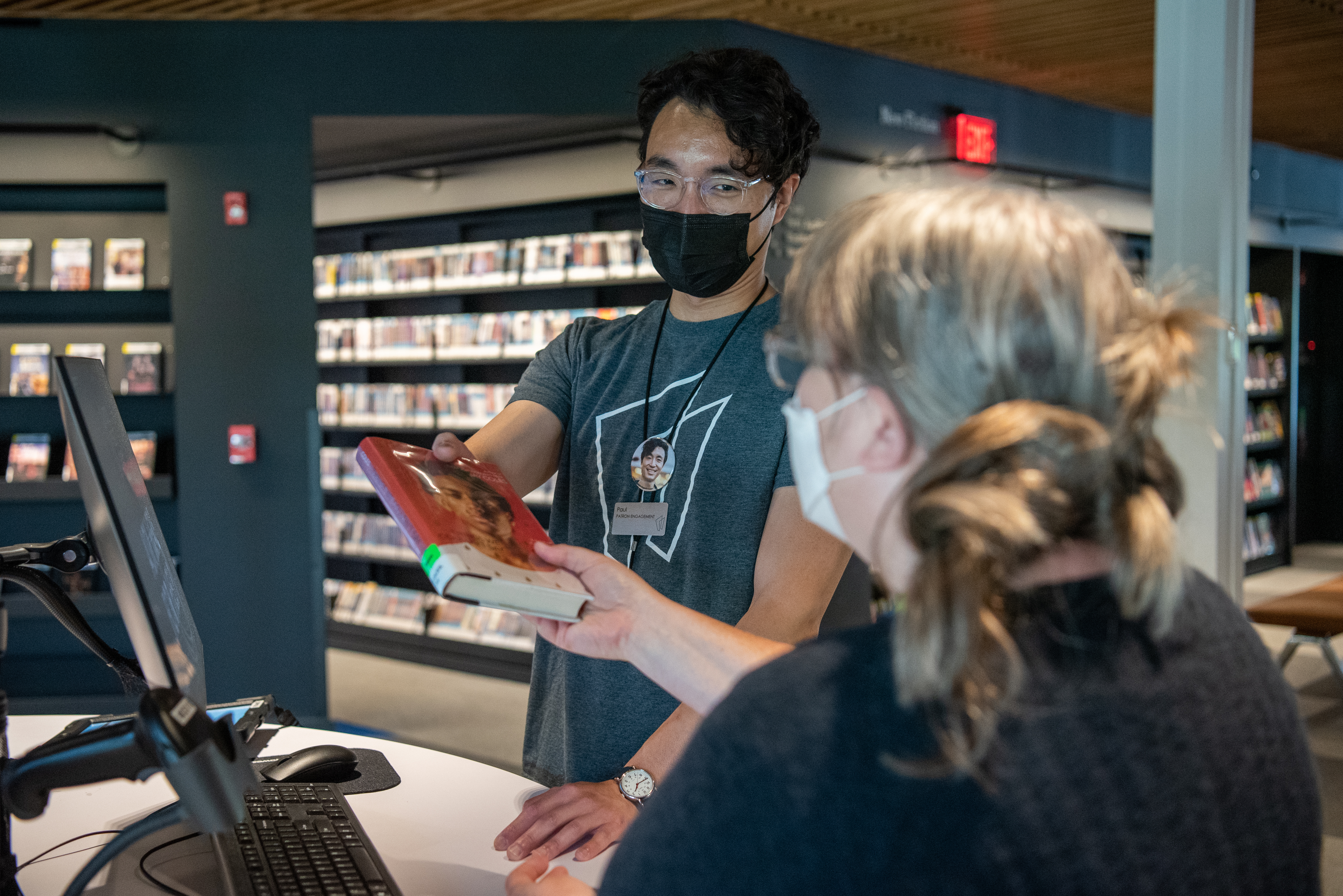 Librarian making book recommendation