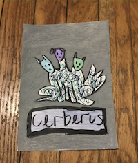 Drawing of Cerberus, a three-headed dog from Greek mythology, using markers and paint pens.