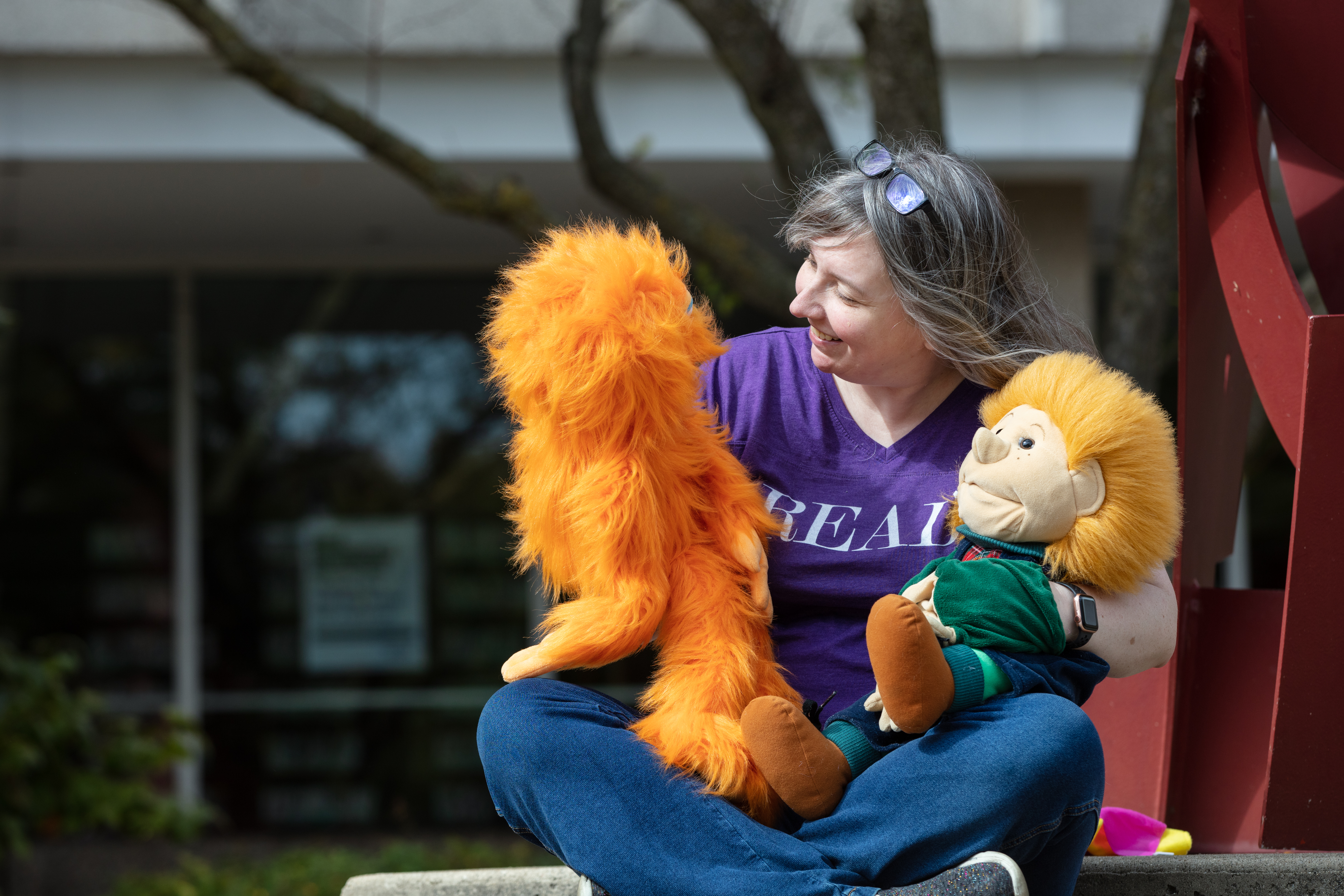 Ms. Mandy talking with her puppet friends